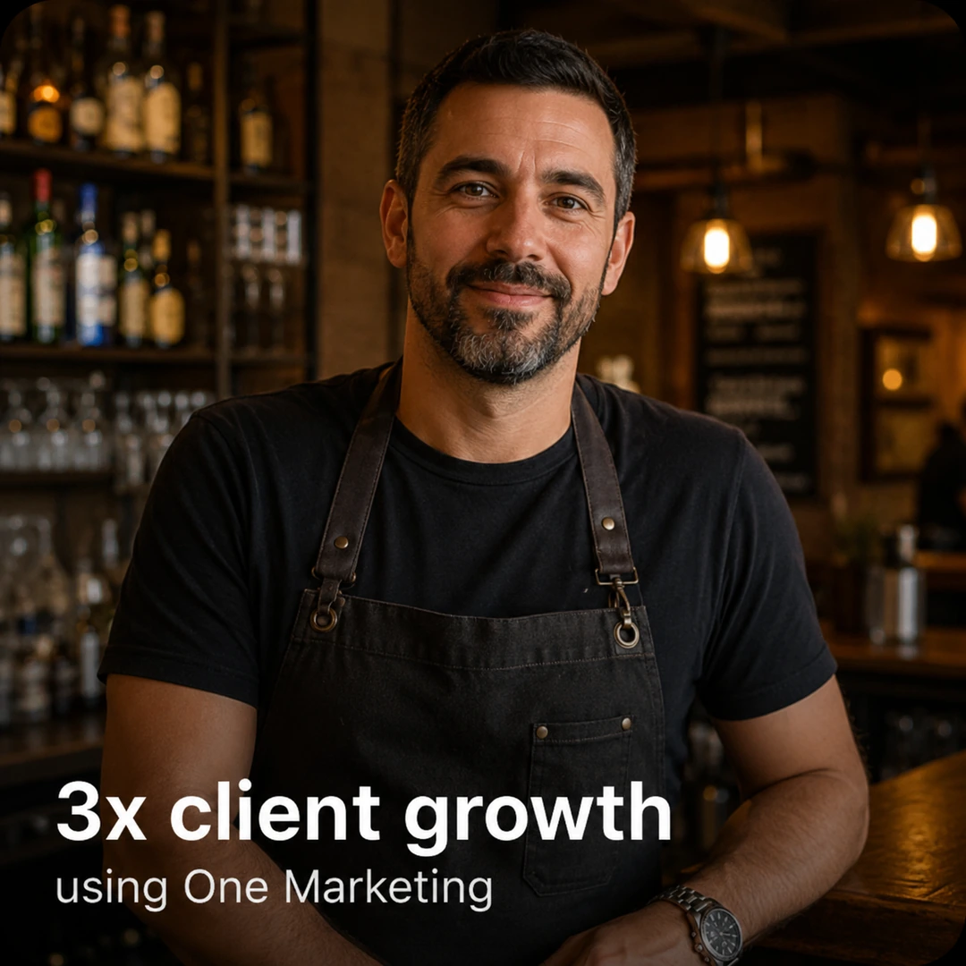 Smiling male business owner standing inside a bar
